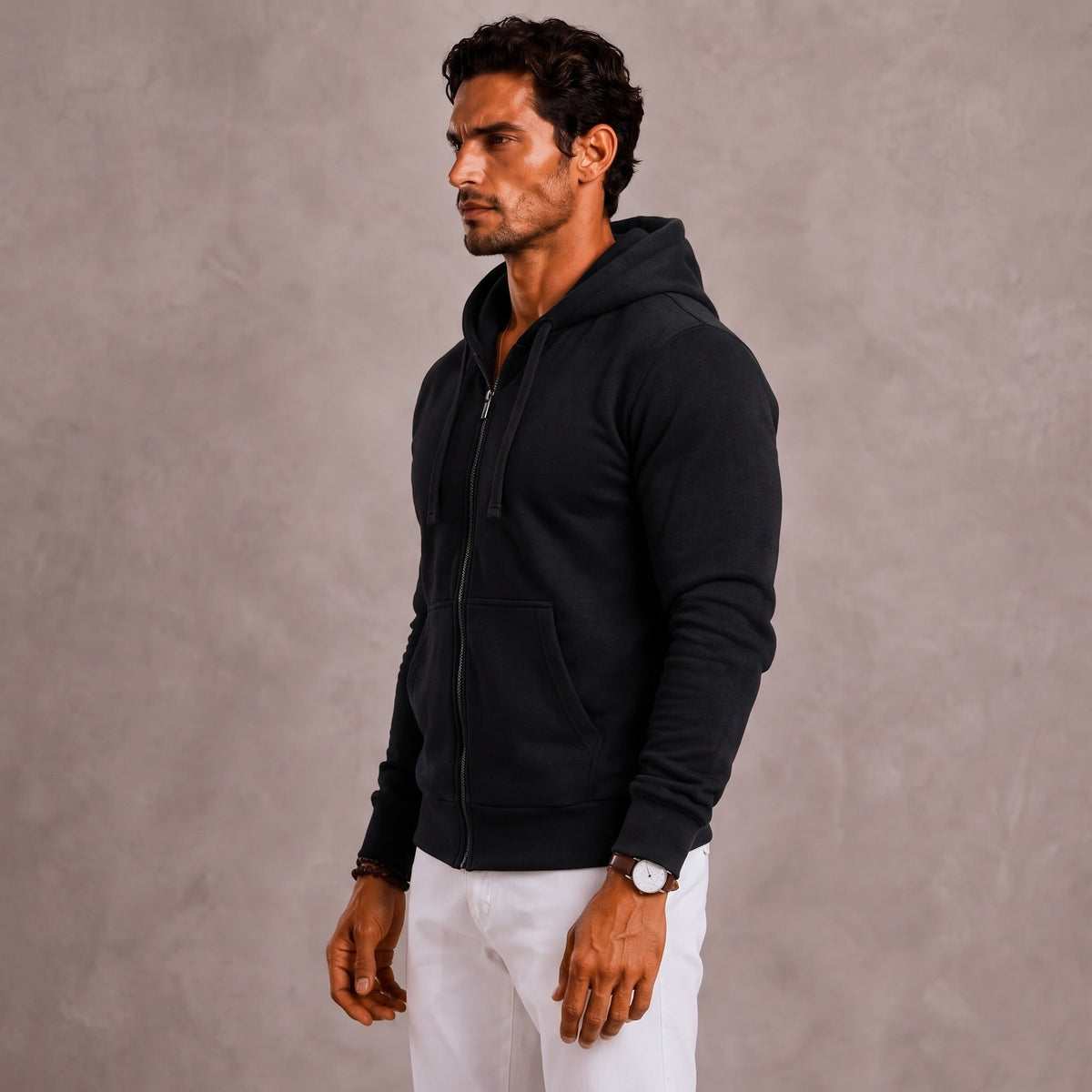 Man wearing black full-zip hoodie with hood, paired with white trousers | Chaps London