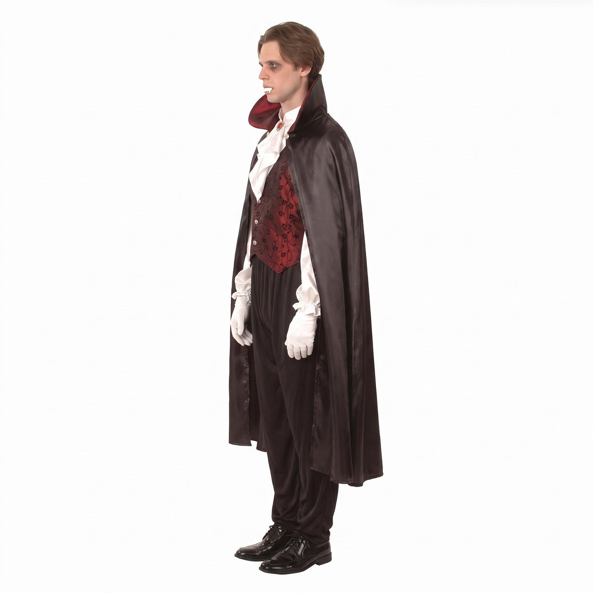 Man wearing black vampire cape with red vest and white jabot shirt | Chaps London