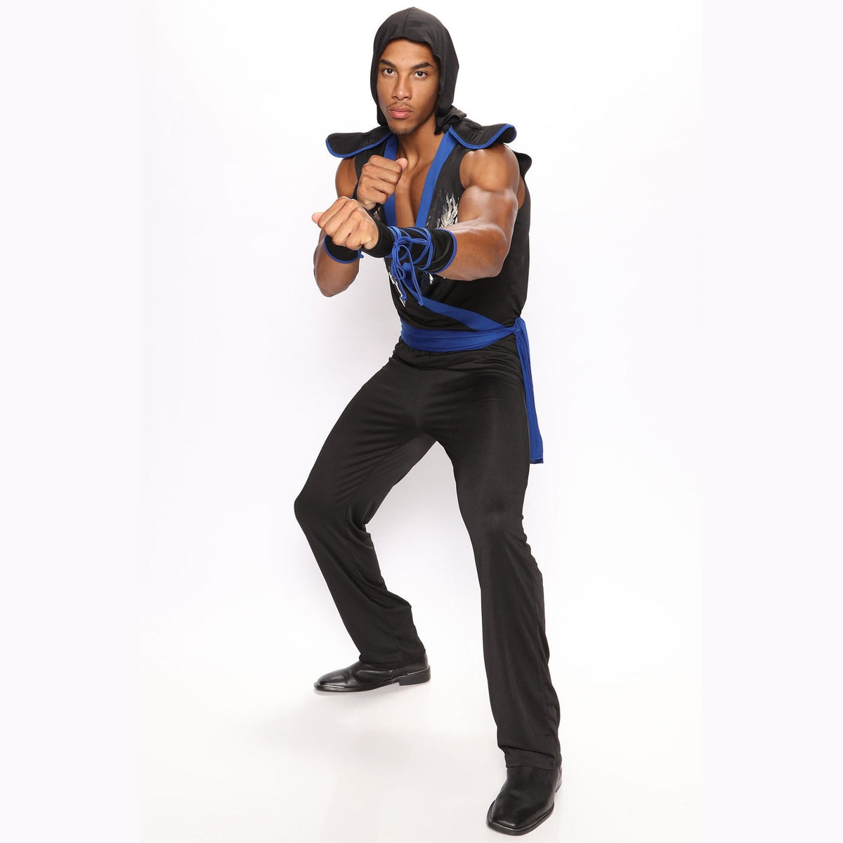 Man wearing black and blue hooded ninja costume in fighting stance | Chaps London
