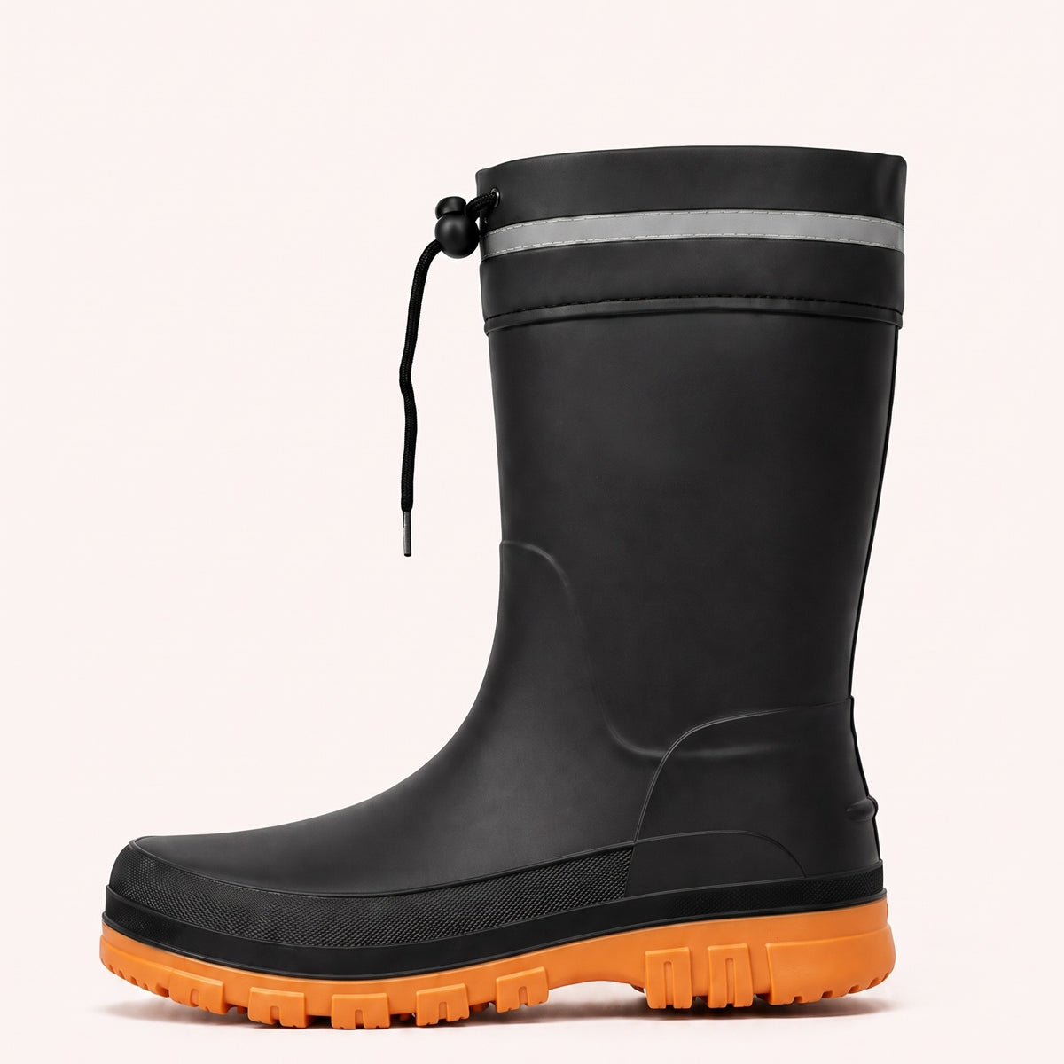 Side view of a black mid calf rain boot with an orange lugged sole, a reflective band and a drawstring at the top.