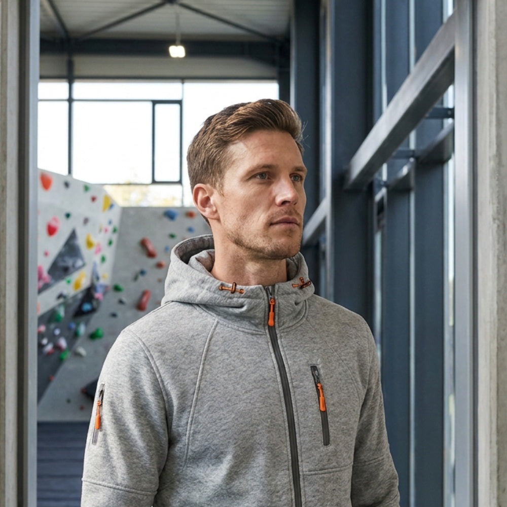 Gray zip hoodie with orange accents worn by man indoors | Chaps London