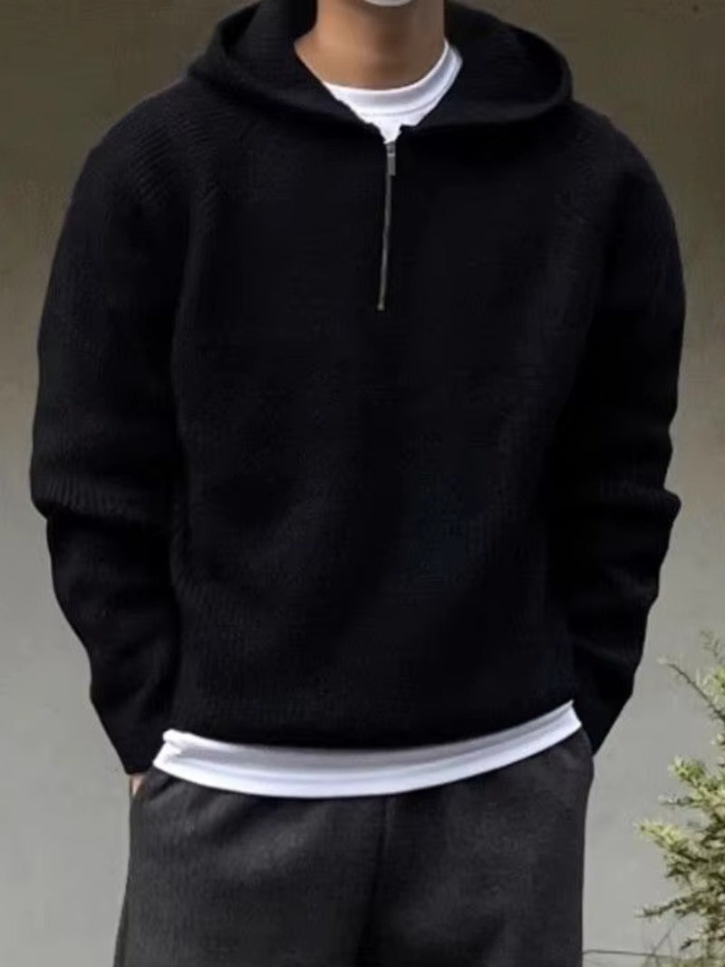 Men's half-zip knit hoodie in black, worn, front view
