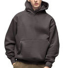 Men's heavyweight cotton hoodie in dark grey, worn, front view
