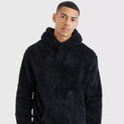 Men's fluffy borg hoodie in black, worn, front view