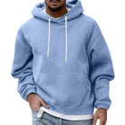 Men's oversized hoodie in light blue, worn, front view