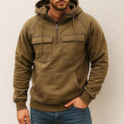 Men's half-zip utility hoodie with chest pockets in khaki, worn, front view