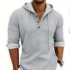 Men's waffle henley hoodie in light grey, worn, front view