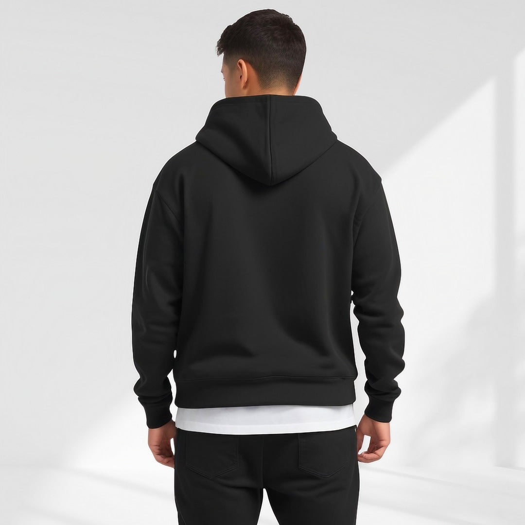 Men's oversized drop-shoulder hoodie in black, worn, back view
