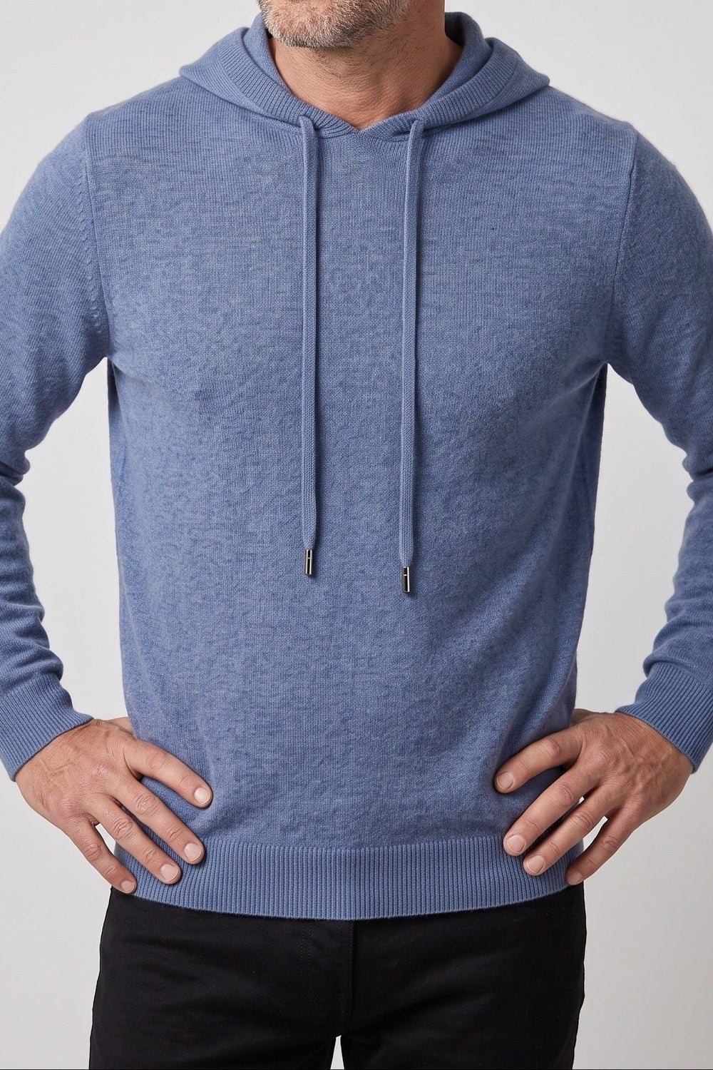 Men's knitted hooded jumper in blue, worn, front view