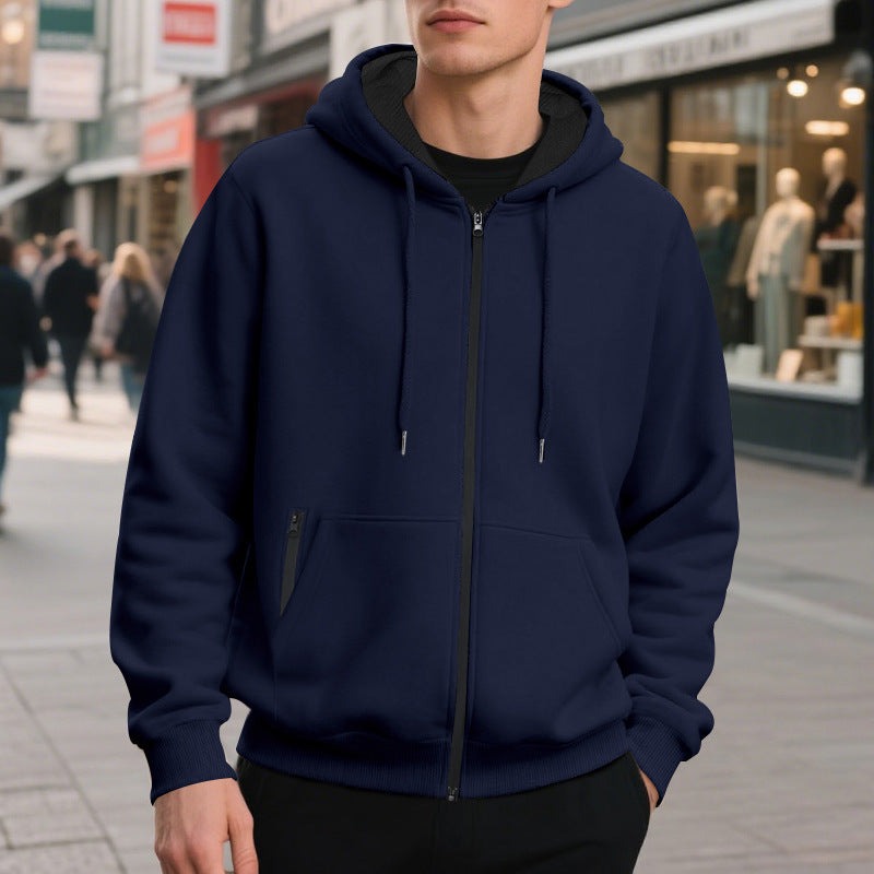 Men's oversized zip-up hoodie in navy, worn, front view