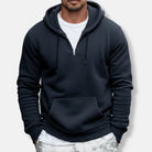 Men's quarter-zip hoodie in navy, worn, front view