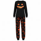 Black Halloween pyjama set with jack-o'-lantern top and pumpkin joggers