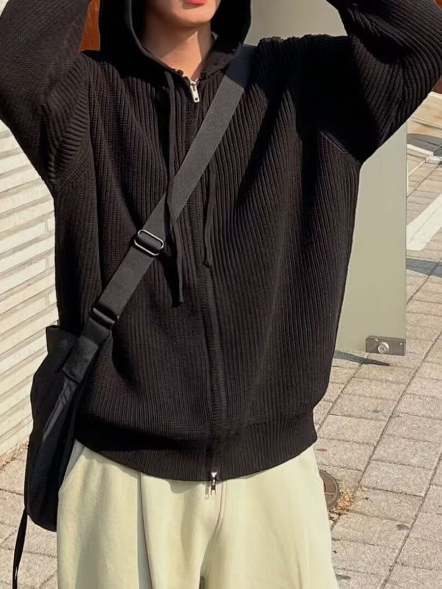 Men's knitted zip hoodie in black, worn, front view