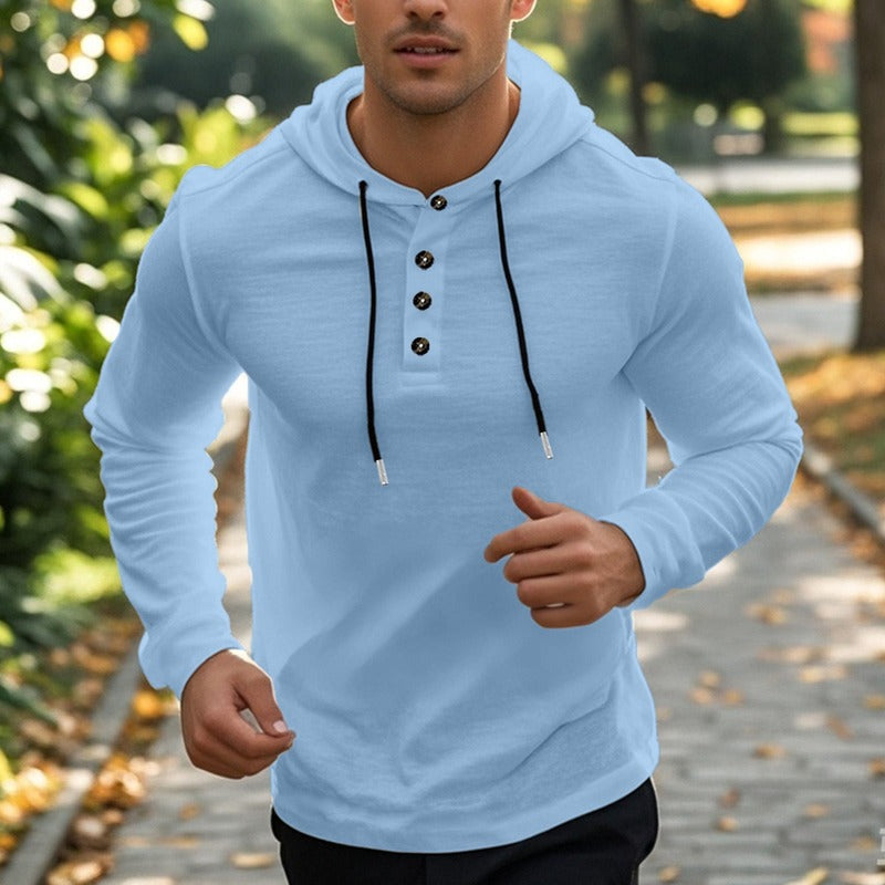 Men's henley hoodie with a button placket in light blue, worn, front view