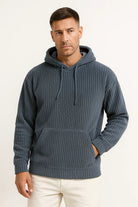 Men's corduroy hoodie in dark blue, worn, front view