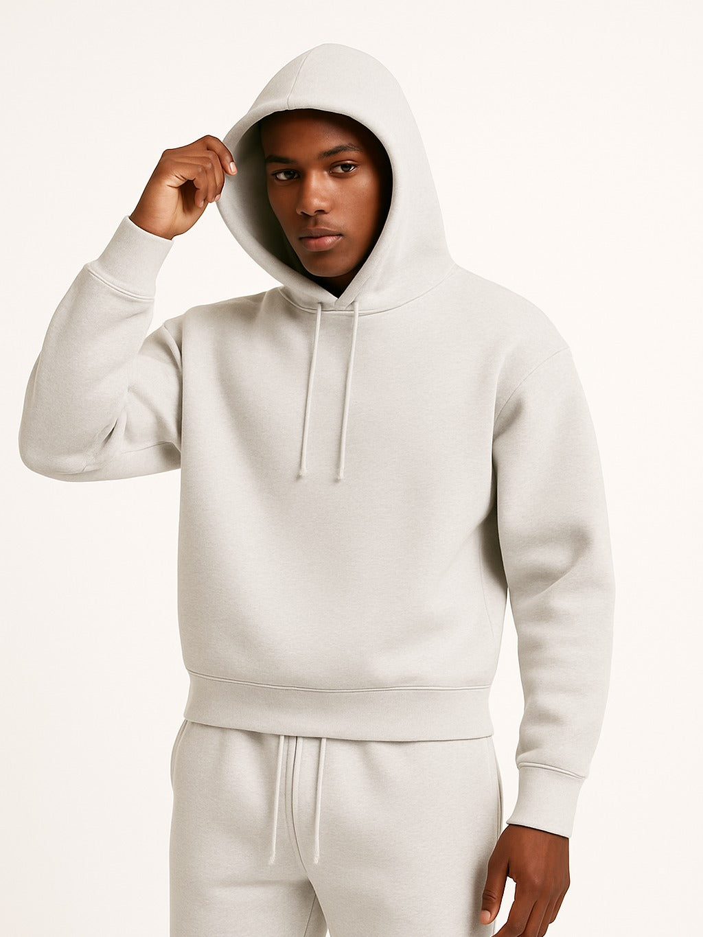 Men's relaxed-fit hoodie in grey, worn, front view
