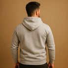 Men's classic drawstring hoodie in light grey, worn, back view
