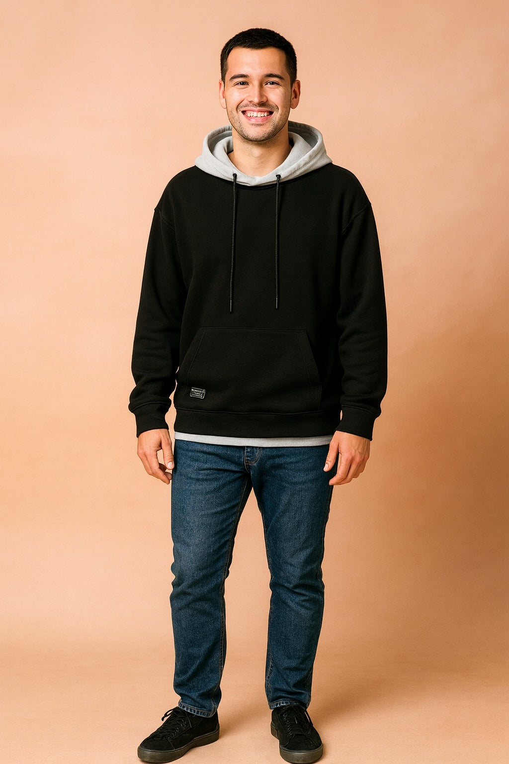 Men's two-tone hoodie with contrast hood in black, worn, front view
