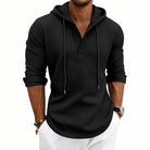 Men's waffle henley hoodie in black, worn, front view