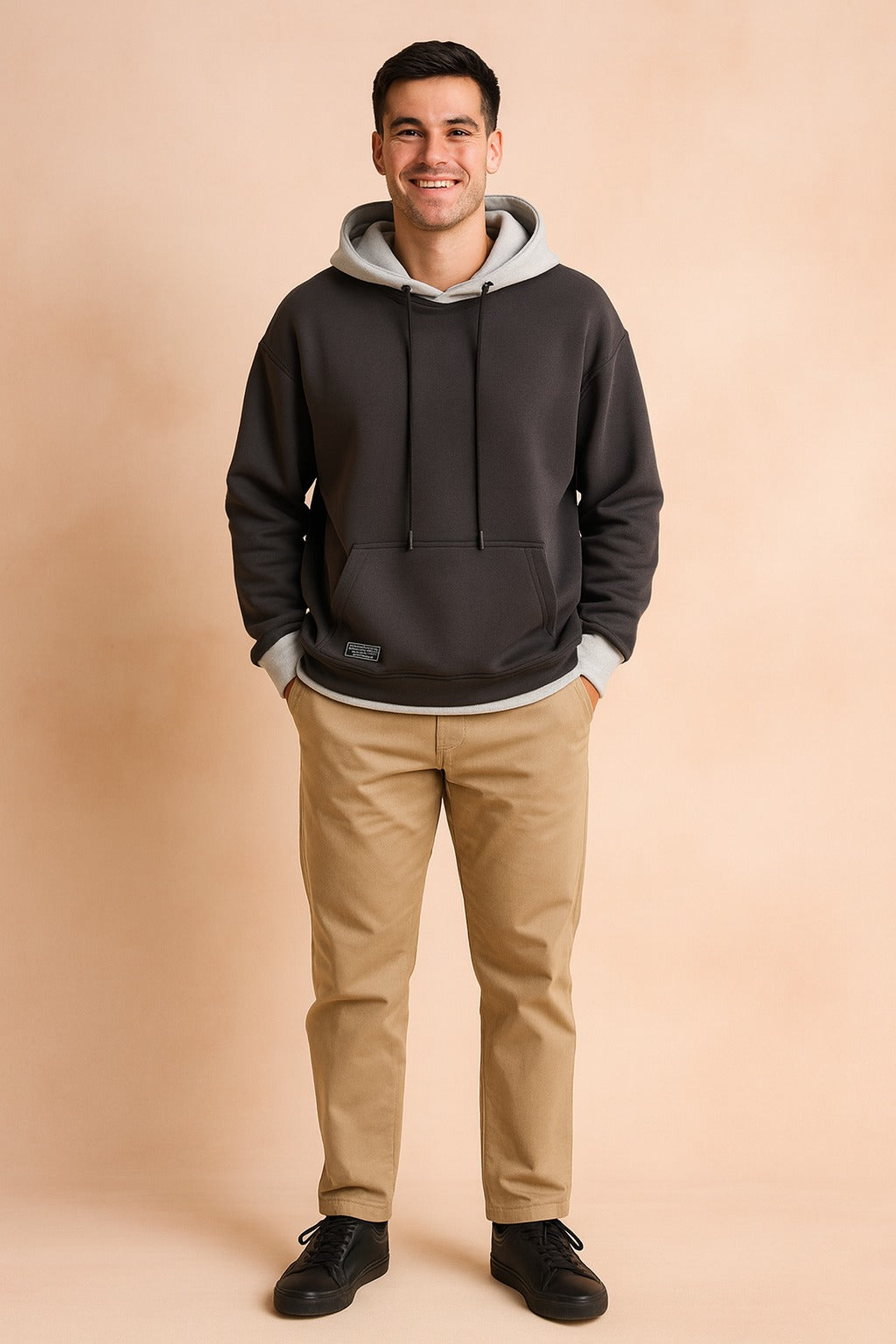Men's two-tone hoodie with contrast hood in dark grey, worn, front view