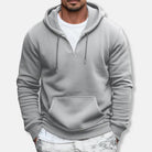 Men's quarter-zip hoodie in grey, worn, front view