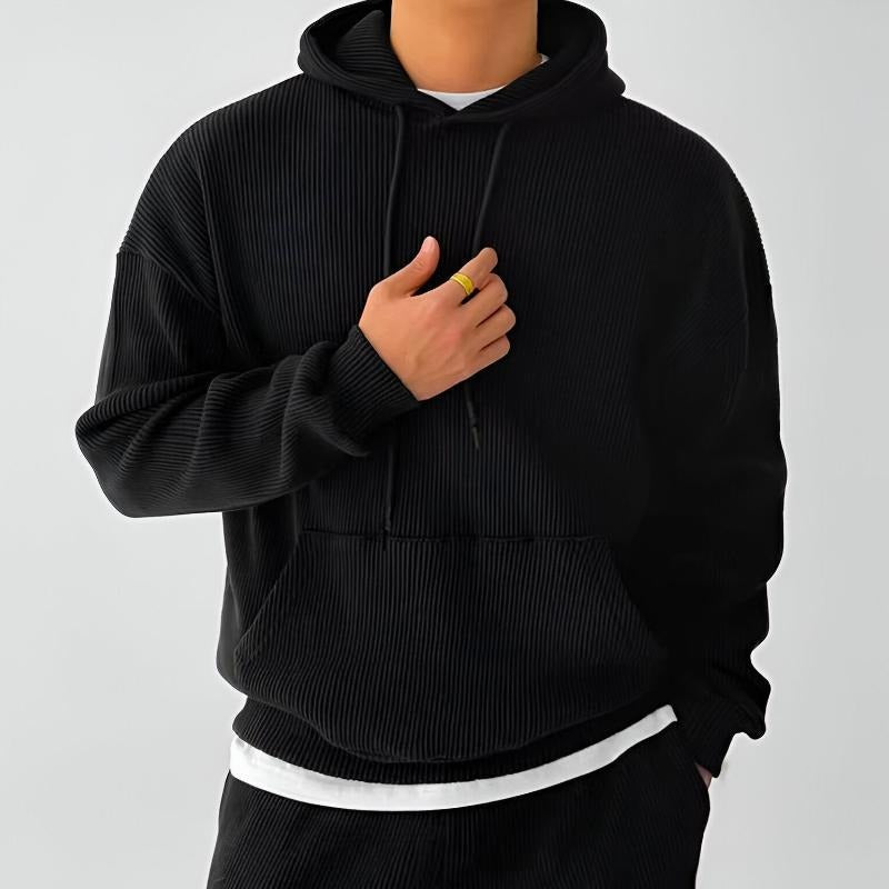 Men's ribbed oversized hoodie in black, worn, front view