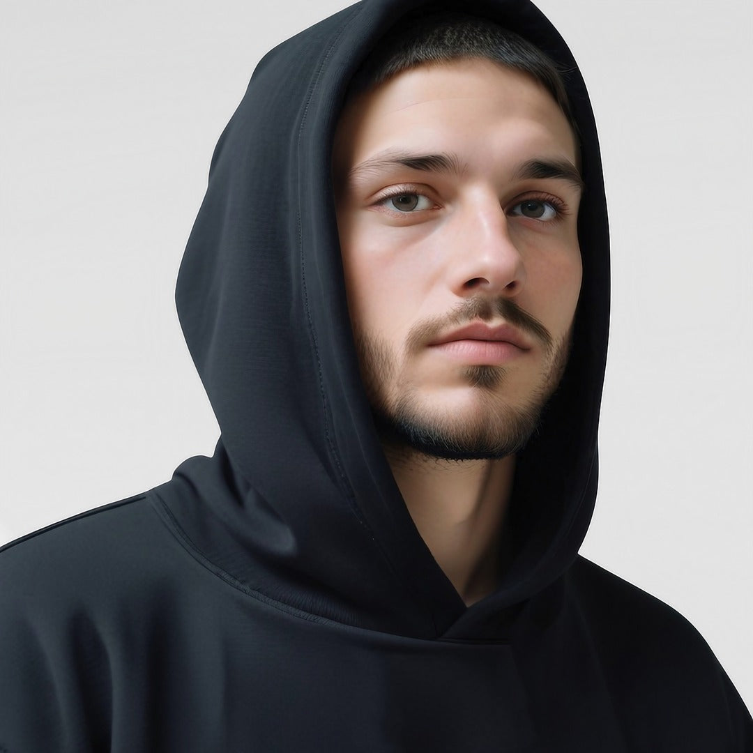 Men's oversized drop-shoulder hoodie in black, close-up of the hood