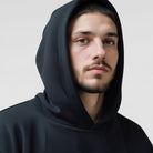 Men's oversized drop-shoulder hoodie in black, close-up of the hood