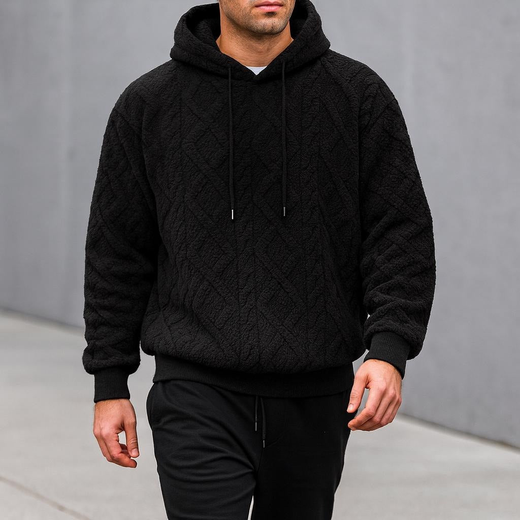Men's quilted teddy fleece hoodie in black, worn, front view