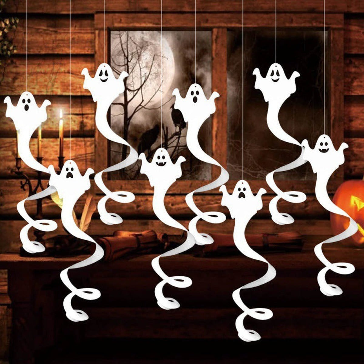 Hanging ghosts in front of a window in a cosy room