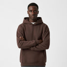 Men's heavyweight hoodie in dark brown, worn, front view