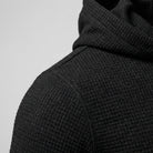 Men's slim-fit gym hoodie in black, close-up of the textured fabric at the shoulder and hood