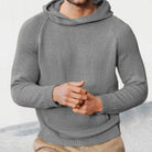 Men's knitted hooded jumper in grey, worn, front view