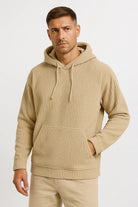 Men's corduroy hoodie in beige, worn, front view