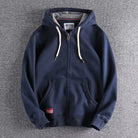 Navy zip-up hoodie with a full-length zip and metal pull, laid flat | Chaps London