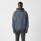 Men's heavyweight hoodie in washed blue, worn, front view