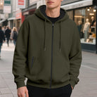 Men's oversized zip-up hoodie in olive green, worn, front view