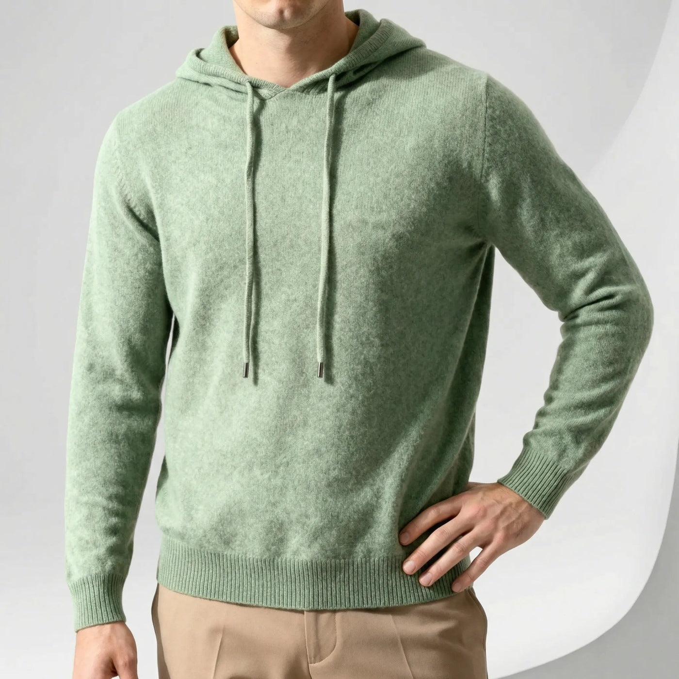 Men's fine-knit hooded jumper in sage green, worn, front view