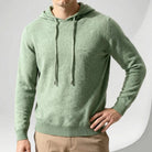 Men's fine-knit hooded jumper in sage green, worn, front view