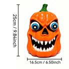 Orange pumpkin figure with scary face and blue eyes, standalone | Chaps London