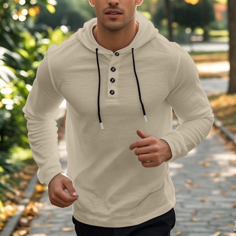 Men's henley hoodie with a button placket in beige, worn, front view