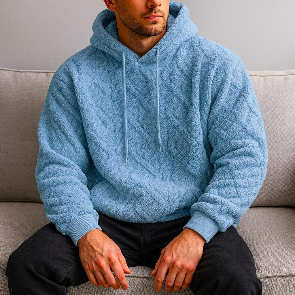 Men's quilted teddy fleece hoodie in light blue, worn, front view