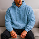 Men's quilted teddy fleece hoodie in light blue, worn, front view