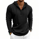 Men's textured quarter-zip hoodie in black, worn, front view