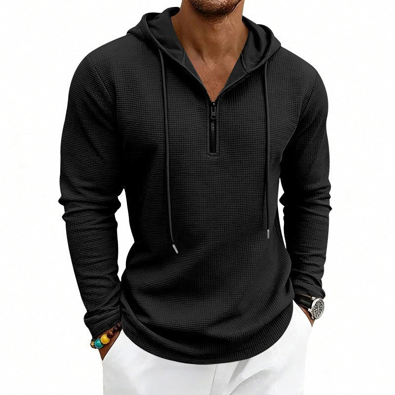Men's textured quarter-zip hoodie in black, worn, front view