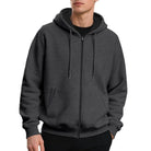 Men's oversized zip-up hoodie in dark grey, worn, front view