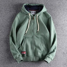Sage green zip-up hoodie with chunky drawcords and ribbed cuffs, laid flat | Chaps London