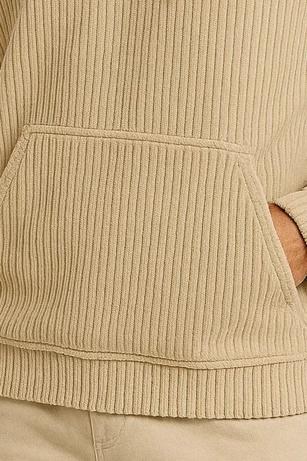 Men's corduroy hoodie in beige, close-up of the corduroy and the kangaroo pocket