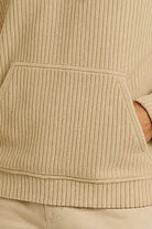 Men's corduroy hoodie in beige, close-up of the corduroy and the kangaroo pocket