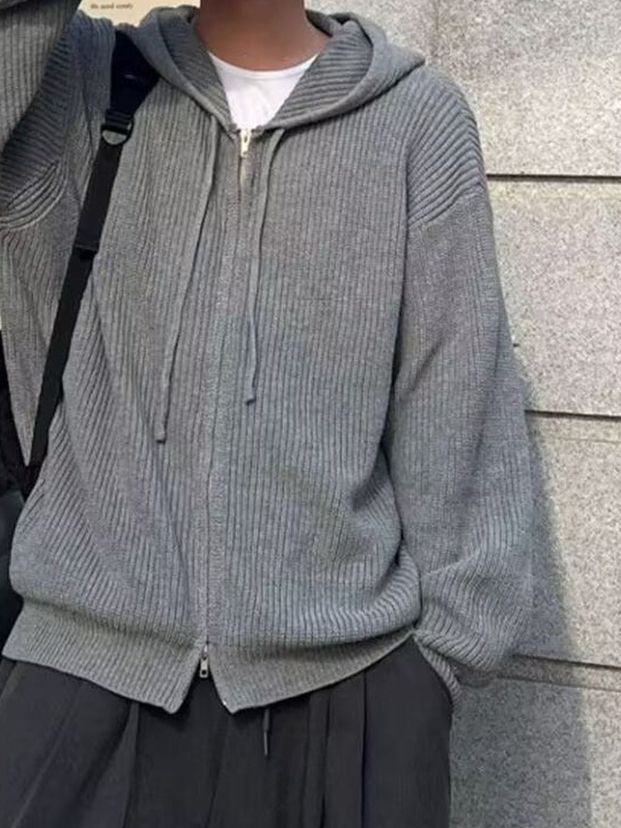 Men's knitted zip hoodie in grey, close-up of the ribbed knit, the zip and the drawstrings